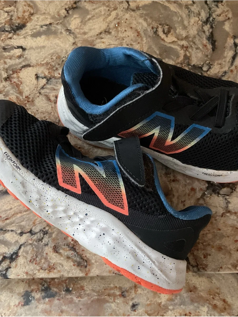 New Balance Kids Black Sneakers with Blue Lining and Coral Accent